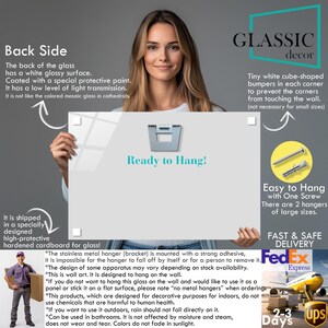 a woman holding a sign that says ready to hang