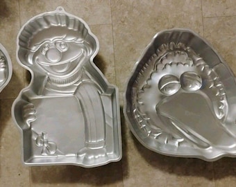 Kavel van 4 vintage Wilton-taartvormen Ernie Big Bird Tweety Dora aluminium