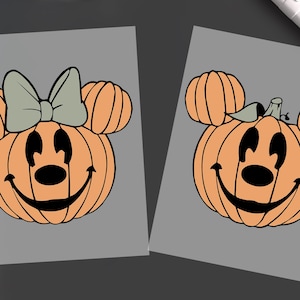 May include: Two rectangular sheets featuring pumpkin graphics. The left sheet shows an orange pumpkin with a black face and a light green bow. The right sheet shows an orange pumpkin with a black face and a small green stem on top.