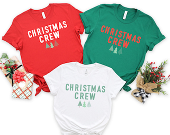May include: Three Christmas themed t-shirts with the text "Christmas Crew" and a row of three stylized Christmas trees. The shirts are red, green, and white.