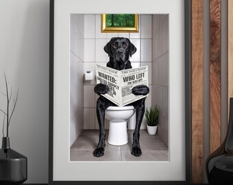 May include: Framed print featuring a black Labrador Retriever sitting on a toilet, reading a newspaper titled "The Daily Scoop." The newspaper headlines read "Wanted: Endless Supply" and "Who Left the Seat Up?" The dog is in a tiled bathroom with a small painting.