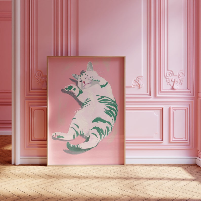 May include: A framed illustration of a white and green striped cat with its eyes closed, lying on its back with its paws in the air. The cat is on a pink background.