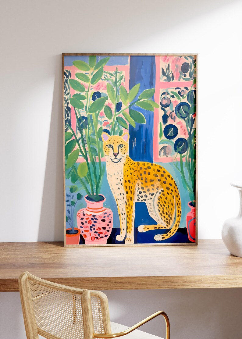 Discover our Cheetah Art Print, a retro-botanical gem featuring a Henri Matisse inspired touch. This trendy maximalist poster adds charm to your gallery wall, conjuring a lush jungle vibe with its tropical plants art print.
