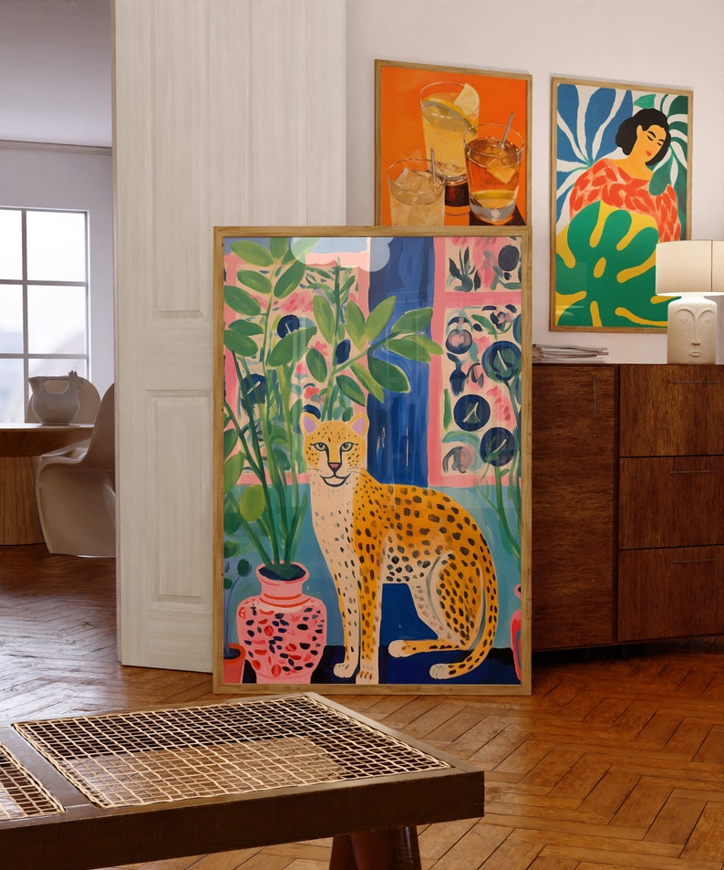 Discover our Cheetah Art Print, a retro-botanical gem featuring a Henri Matisse inspired touch. This trendy maximalist poster adds charm to your gallery wall, conjuring a lush jungle vibe with its tropical plants art print.