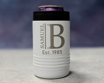 May include: White insulated can cooler with a black lid. The cooler has a personalized inscription that reads "Samuel B Est. 1985".