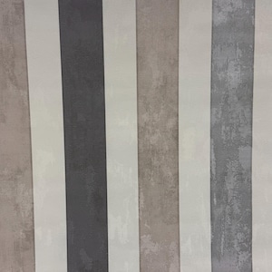 May include: Vertical striped wallpaper in neutral tones. The design features alternating bands of beige, white, dark gray, and light gray with a textured, distressed appearance. The stripes are of varying widths, creating a modern aesthetic.