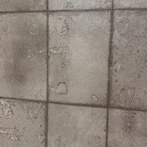 Industrial Concrete Tile Wallpaper – Weathered Stone Look in Charcoal Grey Brown