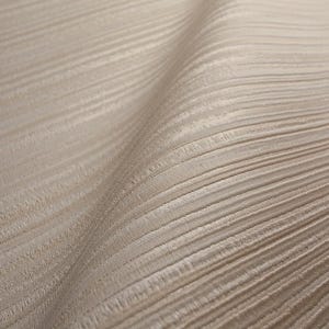 May include: Close-up of a beige fabric with a textured, ribbed pattern. The fabric has a subtle sheen and a flowing, draped appearance. The horizontal lines create a sense of depth and movement.