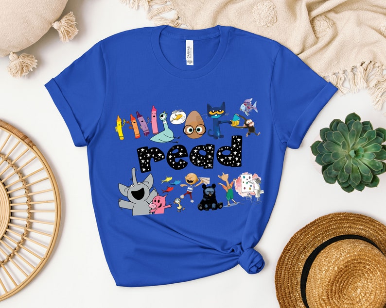 May include: A royal blue t-shirt with a graphic of characters from the book "The Book With No Pictures" and the word "read" in white letters with black stars.