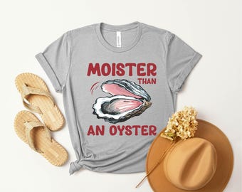 Camiseta "Más húmedo que una ostra": Divertida camiseta retro con gráficos