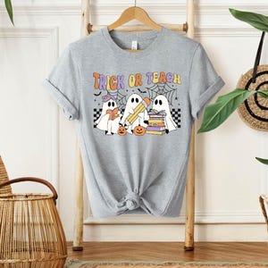 a t - shirt that says trick or treat on it