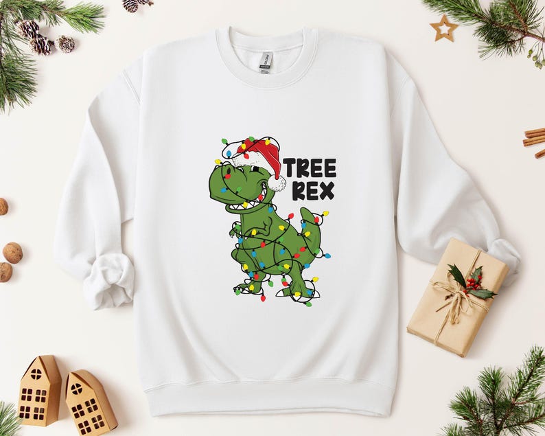 a t - shirt with a dinosaur wearing a christmas hat
