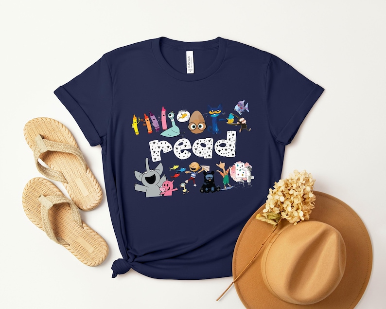 May include: A navy blue t-shirt with a graphic of colorful characters and the words "Everyone read".