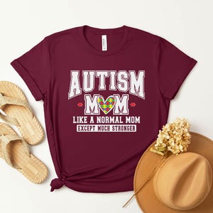 a t - shirt that says autism mom like a normal mom except much shorter