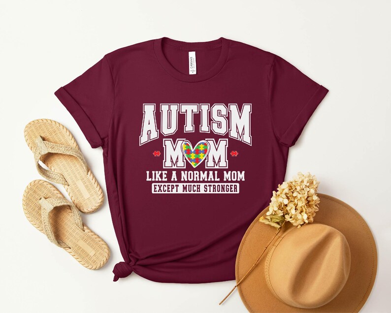 a t - shirt that says autism mom like a normal mom except much shorter