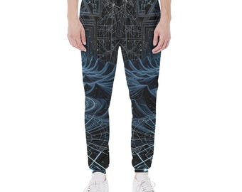 May include: Black and blue patterned sweatpants with a geometric design. The pants feature a dark background with a detailed, abstract pattern in shades of blue and white. The design includes wave-like shapes and geometric lines.