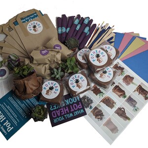 May include: A craft kit for making succulent planters. The kit includes brown clay, brown paper bags, small plants, paintbrushes, and colourful paper. The kit also includes instructions on how to make your own pot head.