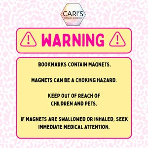May include: A pink and yellow warning sign with the text "WARNING!" and an exclamation mark symbol. The sign warns that bookmarks contain magnets, which can be a choking hazard. It advises keeping them out of reach of children and pets.