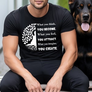 May include: A black t-shirt with a white tree design and the text "What you think, YOU BECOME. What you feel, YOU ATTRACT. What you imagine, YOU CREATE."