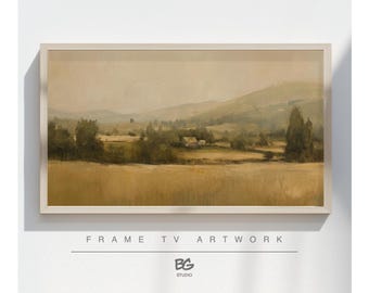 May include: Framed landscape artwork with a serene, muted color palette. The painting depicts rolling hills, fields, and trees under a hazy sky. The frame is a light neutral color. Text at the bottom reads "FRAME TV ARTWORK" and "BG STUDIO".