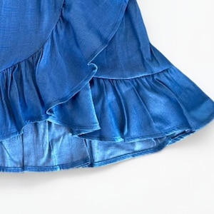 Closeup of Girls Ruffle Wrap Mini Skirt.