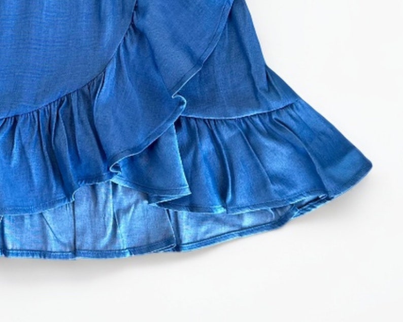 Closeup of Girls Ruffle Wrap Mini Skirt.