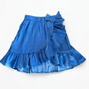 Front view of Girls Ruffle Wrap Mini Skirt.