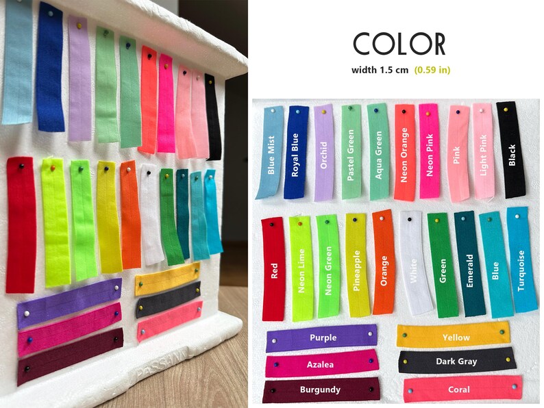May include: A colour chart with 28 fabric swatches in various colours, including red, blue, green, yellow, orange, pink, and black. The swatches are labelled with their colour names and are arranged in rows. The chart is labelled "COLOR" and "width 1.5 cm (0.59 in)".