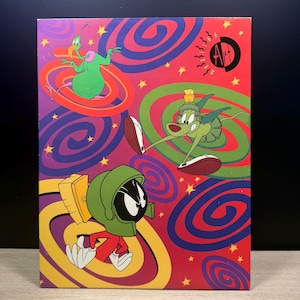 May include: A colorful illustration featuring cartoon characters on a red background with swirling patterns. The characters include a green alien with a helmet, a green dog-like creature, and a green bird-like figure. The artwork has a retro, comic book style.