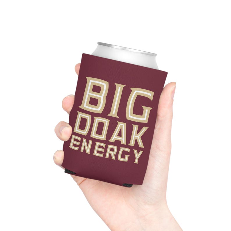May include: A maroon can cooler with the text "BIG OAK ENERGY" in gold lettering.
