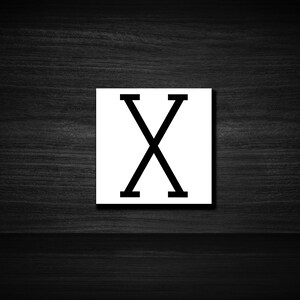 May include: A white square with a black letter X in the center.