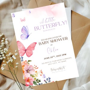 May include: A white ceramic mug with a black handle and the text "But First, Coffee" in a bold, black font. The mug is set against a blurred background, suggesting a cosy setting.