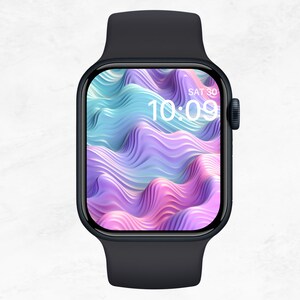 Puede incluir: Un reloj inteligente negro con una banda azul oscuro. La esfera del reloj muestra un diseño abstracto colorido con la hora 10:09 y la fecha SÁB 30.