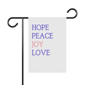 May include: A white garden flag with the words "HOPE", "PEACE", "JOY" in pink, and "LOVE" in purple.
