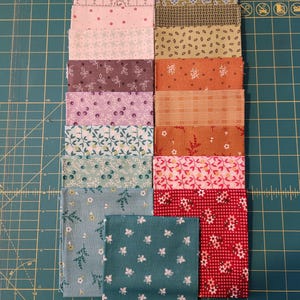 May include: A collection of rectangular fabric swatches arranged in two columns. The patterns include various floral, geometric, and checkered designs in a palette of pink, purple, blue, green, orange, and red hues, featuring small-scale prints.