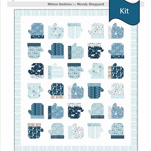 May include: A winter-themed quilt kit featuring a pattern of blue mittens with various designs, including snowflakes, trees, and animal silhouettes. The quilt is 55 x 64 inches and includes the text "Mitten Smitten by Wendy Sheppard" and "Kit".