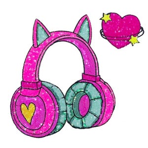 May include: Pink and green sequined headphones with cat ears and a pink heart with a yellow star on each side.