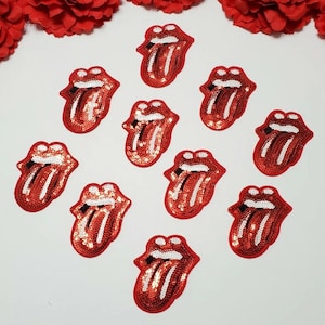 May include: Ten red sequined iron-on patches in the shape of a tongue with a white outline. The patches are perfect for adding a rock and roll vibe to clothing, bags, or other accessories.
