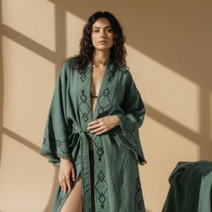 Woman wearing handmade dark green lion print kimono