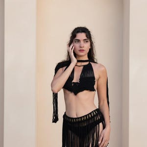 black macramé mini skirt and matching top with goddess necklace