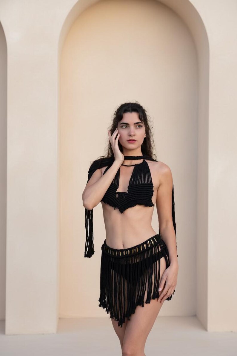 black macramé mini skirt and matching top with goddess necklace