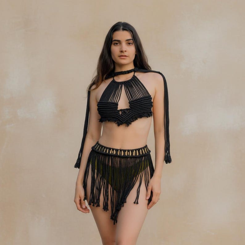 Black macramé goddess beach cover-up set layered over swimwear