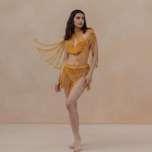 Gold three-piece cotton macramé festival set with skirt top and shoulder necklace