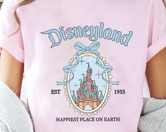 Camiseta vintage con lazo de coqueta del Castillo Mágico de Disneyland / Camiseta del lugar más feliz del mundo / Camiseta familiar del Reino Mágico de WDW 2026 / Camiseta de viaje al castillo