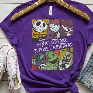 May include: Purple t-shirt with a graphic print of characters from the movie "The Nightmare Before Christmas". The text "The Nightmare Before Christmas" is printed in white on the shirt.