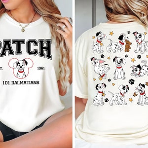 May include: White t-shirt with a black and white graphic of a Dalmatian dog with the text "PATCH EST. 1961 101 DALMATIANS" on the front. The back of the shirt features a pattern of Dalmatian puppies.