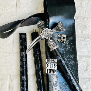 May include: A black walking cane with a silver-colored hammer head and a blade. The cane has a nautical design and comes with a black leather sheath. The text "GLORIOUS GIFTS TOWN" is visible.