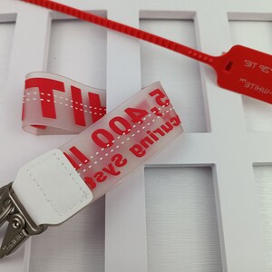 Off-White Keychain with Zip Tie Tag — COP THAT