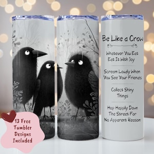 May include: Three black crow-themed tumblers. Two tumblers feature crow illustrations with a grayscale background. The third tumbler has the text "Be Like a Crow" with related phrases. A pink heart-shaped graphic with text is also included.
