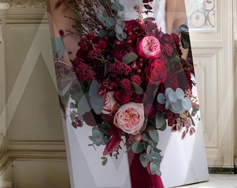 May include: A canvas print of a floral bouquet. The bouquet features deep red roses, pink roses, and various green foliage. The flowers are set against a white backdrop, with a red ribbon. The print is displayed indoors.